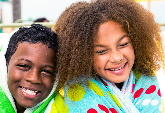 kids in beach towels at Sirata