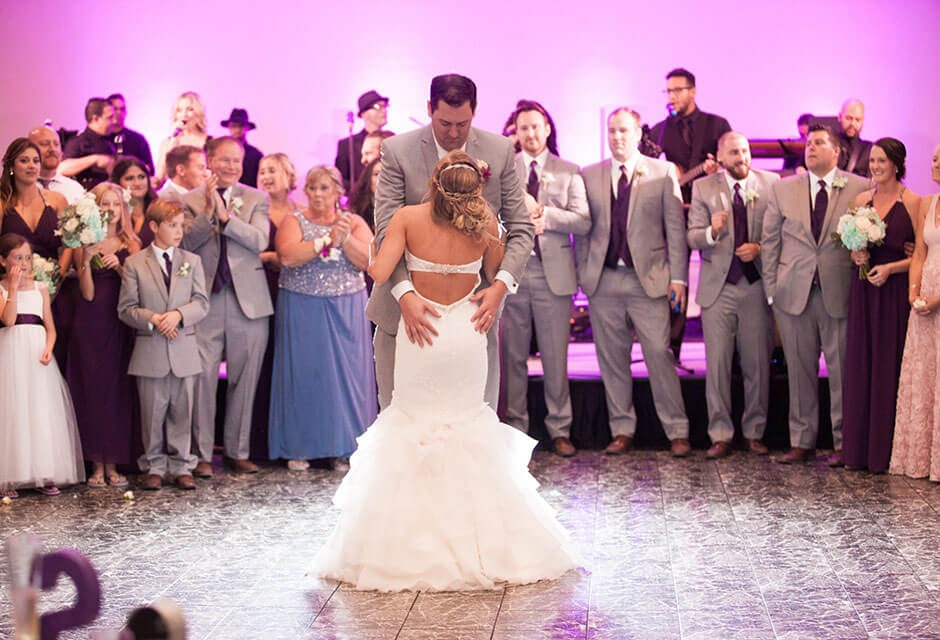 bride and grooms dancing